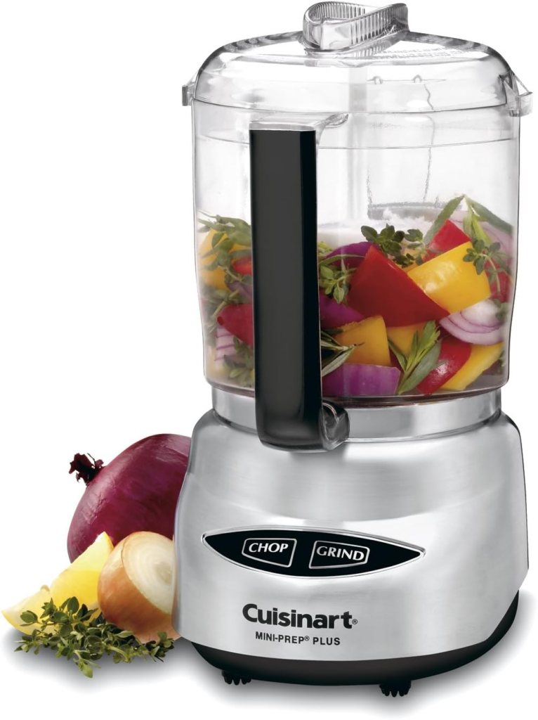 a blender with vegetables in it