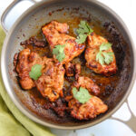 Cooked chicken with cilantro garnish