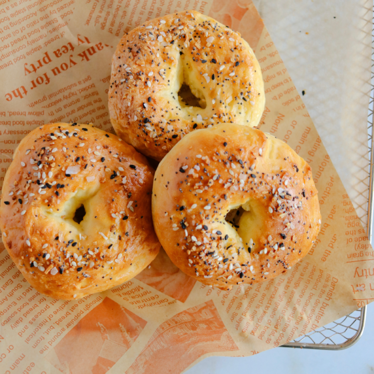 Three bagels on parchment paper